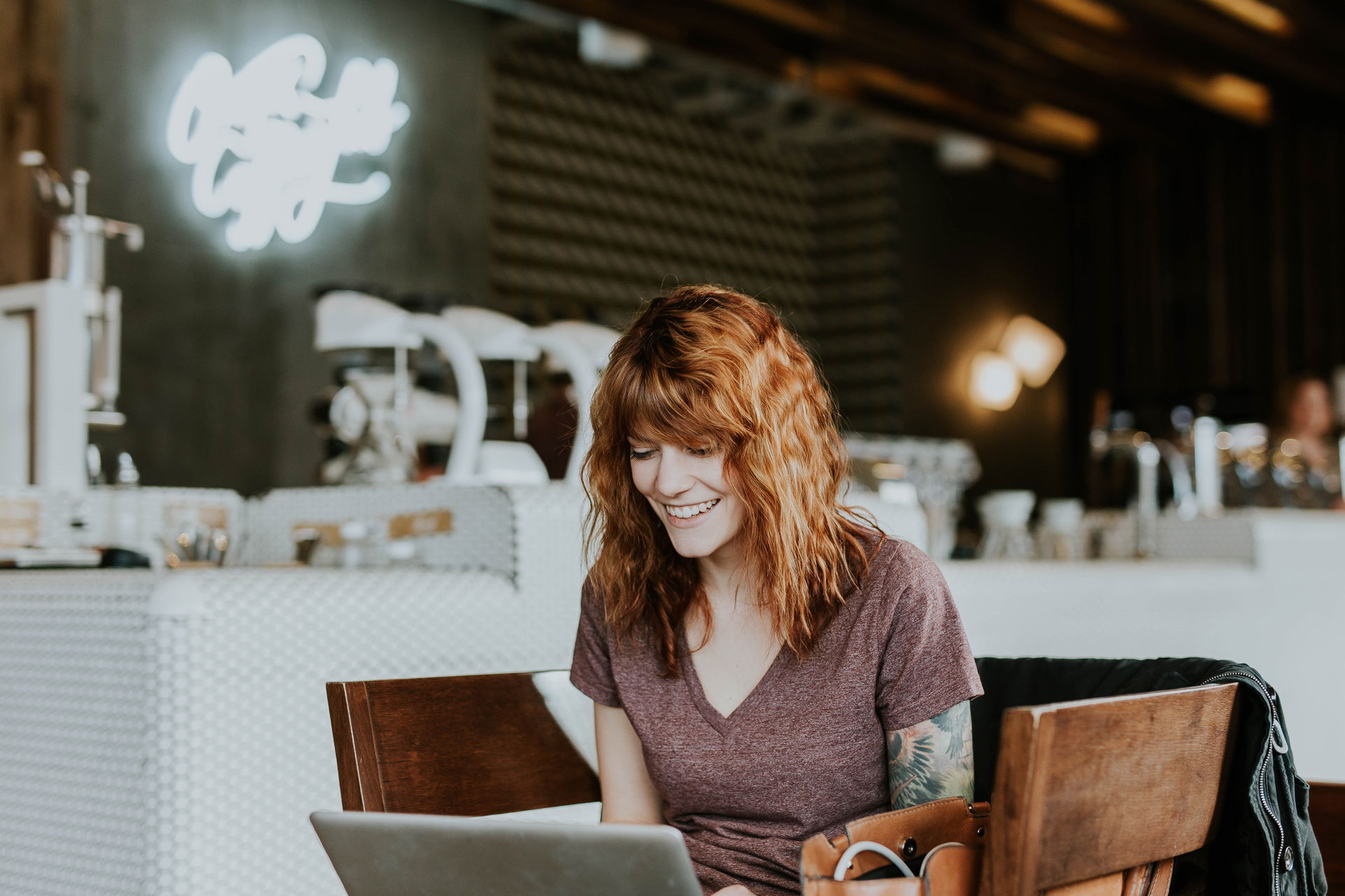 happy-woman-working-on-her-laptop