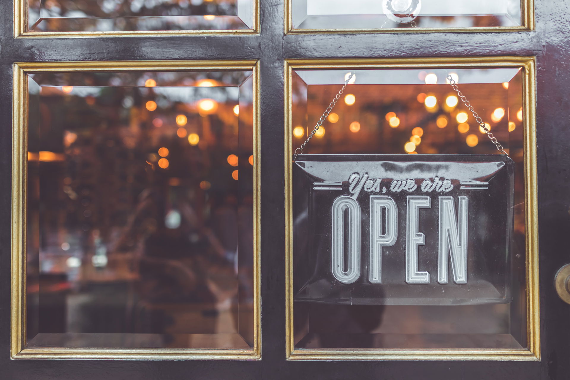 an open sign in a glass window